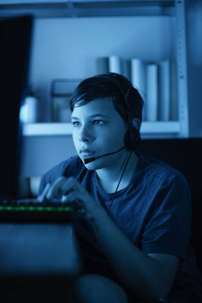 young boy playing computer